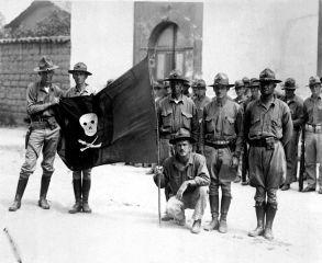 U.S._Marines_holding_Sandino's_Flag_-_Nicaragua_1932.jpg